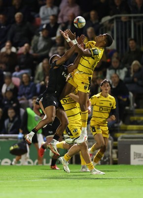 091026 - Dragons RFC v Ospreys - United Rugby Championship - Keelan Giles of Ospreys and Rio Dyer of Dragons go for the ball