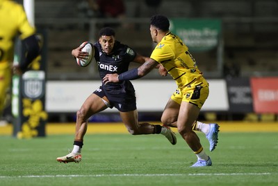 091026 - Dragons RFC v Ospreys - United Rugby Championship - Keelan Giles of Ospreys is tackled by Fetuli Paea of Dragons 