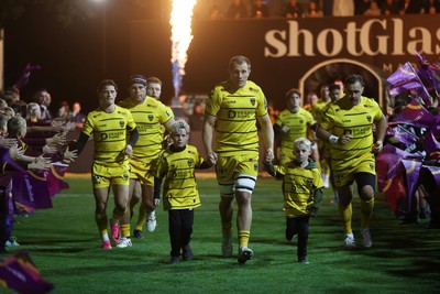 091026 - Dragons RFC v Ospreys - United Rugby Championship - Ben Carter of Dragons runs out with the mascots