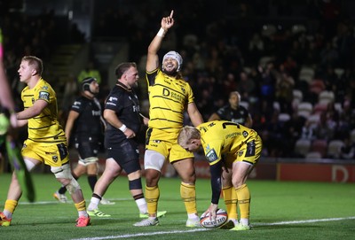 091026 - Dragons RFC v Ospreys - United Rugby Championship - Anzelo Tuitavuki of Dragons celebrates scoring a try with team mates