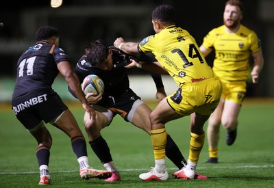 091026 - Dragons RFC v Ospreys - United Rugby Championship - Tom Rogers of Ospreys is tackled by Rio Dyer of Dragons 