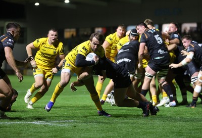 091026 - Dragons RFC v Ospreys - United Rugby Championship - Rhodri Williams of Dragons is tackled by Dan Edwards of Ospreys 