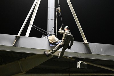 091026 - Dragons RFC v Ospreys - United Rugby Championship - Royal Marines deliver match ball from Rodney Parade roof