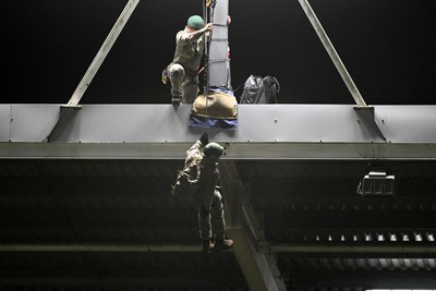 091026 - Dragons RFC v Ospreys - United Rugby Championship - Royal Marines deliver match ball from Rodney Parade roof