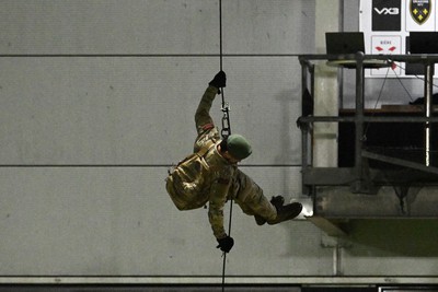 091026 - Dragons RFC v Ospreys - United Rugby Championship - Royal Marines deliver match ball from Rodney Parade roof