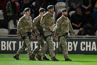 091026 - Dragons RFC v Ospreys - United Rugby Championship - Royal Marines deliver match ball from Rodney Parade roof