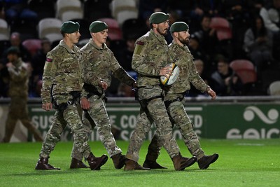 091026 - Dragons RFC v Ospreys - United Rugby Championship - Royal Marines deliver match ball from Rodney Parade roof