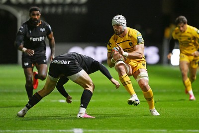 091026 - Dragons RFC v Ospreys - United Rugby Championship - Harri Keddie of Dragons is challenged by Keiran Williams of Ospreys