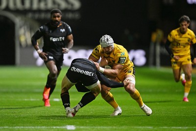 091026 - Dragons RFC v Ospreys - United Rugby Championship - Harri Keddie of Dragons is challenged by Keiran Williams of Ospreys