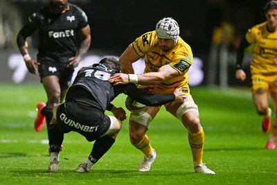 091026 - Dragons RFC v Ospreys - United Rugby Championship - Harri Keddie of Dragons is challenged by Dan Edwards of Ospreys