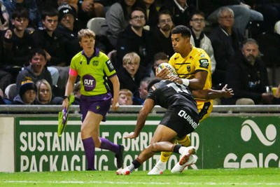 091026 - Dragons RFC v Ospreys - United Rugby Championship - Rio Dyer of Dragons is challenged by Keelan Giles of Ospreys