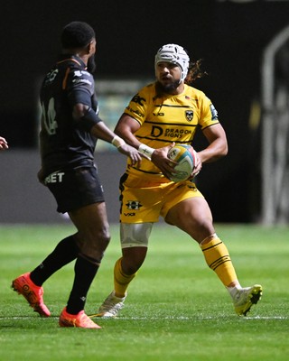 091026 - Dragons RFC v Ospreys - United Rugby Championship - Anzelo Tuitavuki of Dragons is challenged by Marika Koroibete of Ospreys