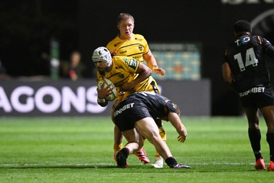 091026 - Dragons RFC v Ospreys - United Rugby Championship - Anzelo Tuitavuki of Dragons is challenged by Dan Edwards of Ospreys