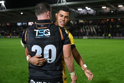 091026 - Dragons RFC v Ospreys - United Rugby Championship - Rio Dyer of Dragons and Morgan Morse of Ospreys at full time
