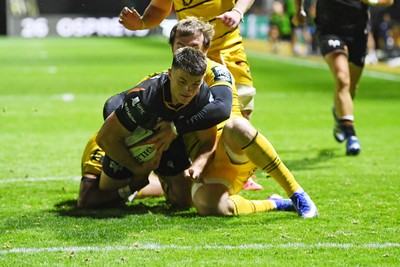 091026 - Dragons RFC v Ospreys - United Rugby Championship - Reuben Morgan Williams of Ospreys is challenged by Rhodri Williams of Dragons