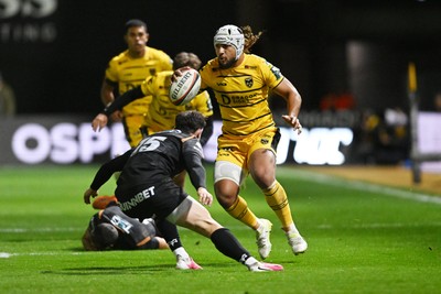 091026 - Dragons RFC v Ospreys - United Rugby Championship - Anzelo Tuitavuki of Dragons is challenged by Tom Rogers of Ospreys