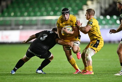 091026 - Dragons RFC v Ospreys - United Rugby Championship - Seb Davies of Dragons is challenged by Tom Botha of Ospreys