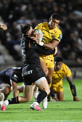 091026 - Dragons RFC v Ospreys - United Rugby Championship - Rio Dyer of Dragons is challenged by Tom Rogers of Ospreys