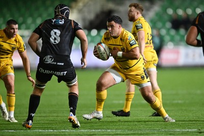 091026 - Dragons RFC v Ospreys - United Rugby Championship - Chris Coleman of Dragons is challenged by Morgan Morris of Ospreys