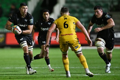 091026 - Dragons RFC v Ospreys - United Rugby Championship - Rhys Davies of Ospreys is challenged by Shane Lewis-Hughes of Dragons