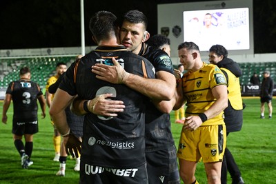 091026 - Dragons RFC v Ospreys - United Rugby Championship - Rhys Davies of Ospreys with Liam Wright of Ospreys at full time