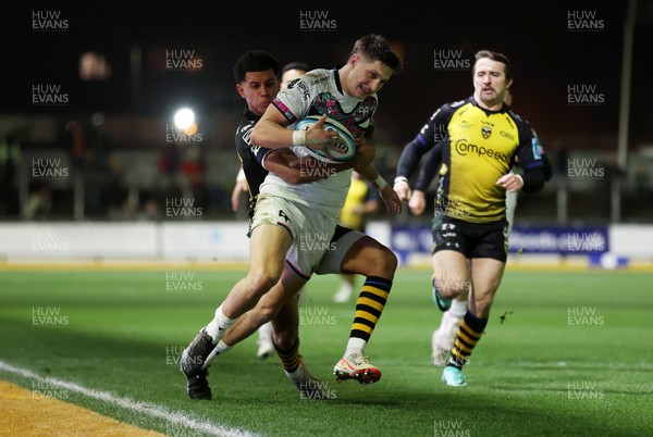 181123 - Dragons RFC v Ospreys - United Rugby Championship - Max Nagy of Ospreys is pushes into touch by Rio Dyer of Dragons 