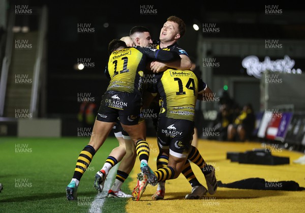 181123 - Dragons RFC v Ospreys - United Rugby Championship - Rio Dyer of Dragons celebrates scoring a try with team mates