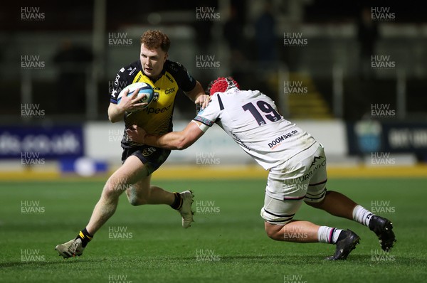 181123 - Dragons RFC v Ospreys - United Rugby Championship - Aneurin Owen of Dragons is tackled by James Fender of Ospreys 