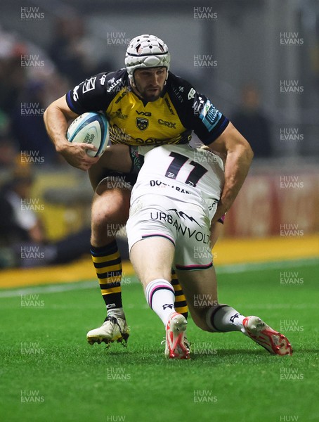 181123 - Dragons RFC v Ospreys, BKT United Rugby Championship - Ollie Griffiths of Dragons is tackled by Mat Protheroe of Ospreys