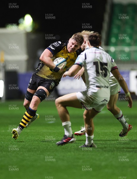 181123 - Dragons RFC v Ospreys, BKT United Rugby Championship - Matthew Screech of Dragons takes Mat Protheroe of Ospreys and Max Nagy of Ospreys