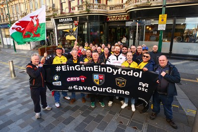 251025 - Dragons RFC v Ospreys - United Rugby Championship - Supporters of Dragons and Ospreys join together on a protest march through Newport centre before the game