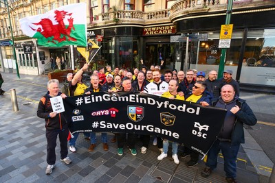 251025 - Dragons RFC v Ospreys - United Rugby Championship - Supporters of Dragons and Ospreys join together on a protest march through Newport centre before the game