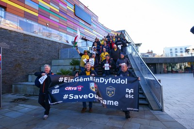 251025 - Dragons RFC v Ospreys - United Rugby Championship - Supporters of Dragons and Ospreys join together on a protest march through Newport centre before the game