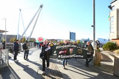 251025 - Dragons RFC v Ospreys - United Rugby Championship - Supporters of Dragons and Ospreys join together on a protest march through Newport centre before the game