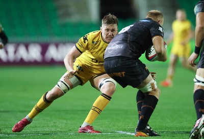 251025 - Newport RFC v Ospreys, United Rugby Championship - Matthew Screech of Dragons takes on Huw Sutton of Ospreys 