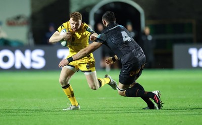 251025 - Newport RFC v Ospreys, United Rugby Championship - Aneurin Owen of Dragons takes on Ryan Smith of Ospreys