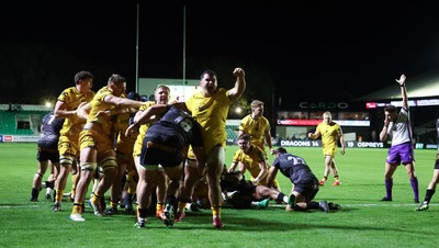 251025 - Newport RFC v Ospreys, United Rugby Championship - Dragons celebrate as Oli Burrows of Dragons powers over to score try
