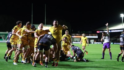 251025 - Newport RFC v Ospreys, United Rugby Championship - Dragons celebrate as Oli Burrows of Dragons powers over to score try