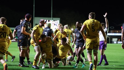 251025 - Newport RFC v Ospreys, United Rugby Championship - Dragons celebrate as Oli Burrows of Dragons powers over to score try