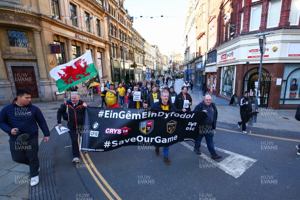 251025 - Dragons RFC v Ospreys - United Rugby Championship - Supporters of Dragons and Ospreys join together on a protest march through Newport centre before the game