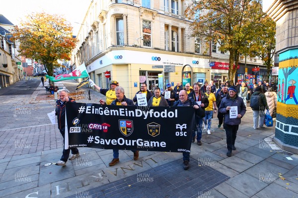 251025 - Dragons RFC v Ospreys - United Rugby Championship - Supporters of Dragons and Ospreys join together on a protest march through Newport centre before the game