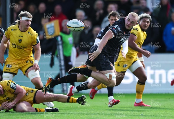 251025 - Newport RFC v Ospreys, United Rugby Championship - Huw Sutton of Ospreys offloads as he is tackled
