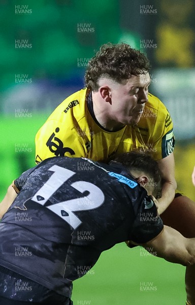 251025 - Newport RFC v Ospreys, United Rugby Championship - Brodie Coghlan of Dragons takes on Max Nagy of Ospreys