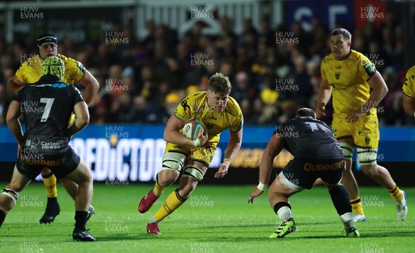 251025 - Newport RFC v Ospreys, United Rugby Championship - Matthew Screech of Dragons takes on Gareth Thomas of Ospreys