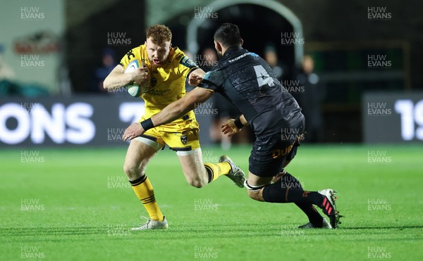 251025 - Newport RFC v Ospreys, United Rugby Championship - Aneurin Owen of Dragons takes on Ryan Smith of Ospreys