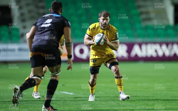 251025 - Newport RFC v Ospreys, United Rugby Championship - Thomas Young of Dragons takes on Ryan Smith of Ospreys