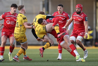 010126 - Dragons RFC v Scarlets - United Rugby Championship - David Richards of Dragons is tackled by Joe Roberts of Scarlets 