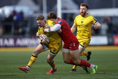 010126 - Dragons RFC v Scarlets - United Rugby Championship - Angus O'Brien of Dragons is tackled by Joe Hawkins of Scarlets 