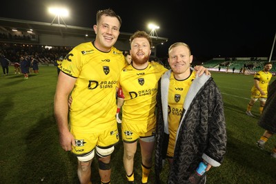 010126 - Dragons RFC v Scarlets - United Rugby Championship - Ben Carter, Aneurin Owen and Tinus De Beer of Dragons at full time