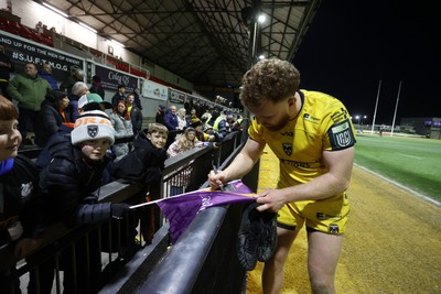 010126 - Dragons RFC v Scarlets - United Rugby Championship - Aneurin Owen of Dragons with fans